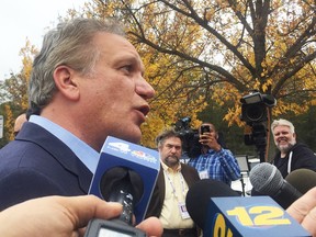 FILE - In this Oct. 20, 2016, file photo, Edward Mangano, a former suburban New York county executive, leaves the federal courthouse in Central Islip, N.Y. Mangano and his wife, Linda, will be on trial in Central Islip beginning Monday, March 12, 2017. The indictment charges that Mangano received bribes and kickbacks to help a businessman obtain guaranteed loans. Linda Mangano is charged with accepting a $450,000 no-show job at the businessman's restaurant and lying to federal investigators. Also on trial is John Venditto, a former Oyster Bay town supervisor. All three have pleaded not guilty to charges of extortion, bribery and more.