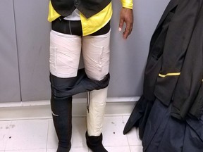 This photo provided by the U.S. Customs and Border Protection on Thursday, March 22, 2018, shows Fly Jamaica Airways crew member Hugh Hall as he was searched and arrested at New York's Kennedy Airport with four packages of cocaine taped to his legs on Saturday, March 17, 2018. The agency says it seized about 9 pounds of cocaine, with a street value of about $160,000. (U.S. Customs via AP)