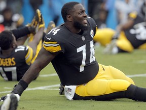 FILE - In this Thursday, Aug. 31, 2017, file photo, Pittsburgh Steelers' Chris Hubbard (74) stretches before the first half of an NFL preseason football game against the Carolina Panthers in Charlotte, N.C. A person familiar with the negotiations says free agent offensive tackle Chris Hubbard has agreed to sign a five-year contract with the Cleveland Browns.