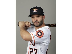 File-This is a 2018 photo  shows Jose Altuve of the Houston Astros baseball team. A person familiar with the negotiations says AL MVP Altuve and the World Series champion Astros have agreed to a contract that guarantees him an additional $151 million over five seasons from 2020-24. The person spoke to The Associated Press on condition of anonymity Friday, March 16, 2018, because the agreement had not been announced.