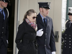 Eileen Davidson, wife of firefighter Michael Davidson, leaves his wake in Floral Park, N.Y., Sunday, March 25, 2018. The New York City firefighter died early Friday battling a fierce blaze on a movie set after getting separated from his fellow firefighters in the thick smoke.
