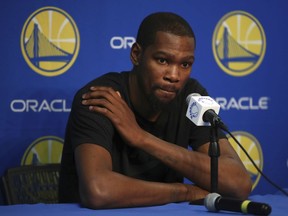 Golden State Warriors' Kevin Durant speaks during a media conference on Friday, March 16, 2018, in Oakland, Calif. Durant will miss 1-2 weeks to allow a rib injury to heal.