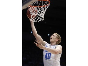 UCLA's Thomas Welsh shoots during the first half of a First Four game of the NCAA college basketball tournament against St. Bonaventure, Tuesday, March 13, 2018, in Dayton, Ohio.