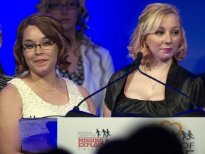 FILE - In this May 6, 2014, file photo, kidnapping survivors Gina DeJesus, left, and Amanda Berry are honored at the annual National Center for Missing and Exploited Children's Hope Awards dinner in Washington. DeJesus, one of three women who escaped a Cleveland home after being held captive for a decade has joined a child abduction alert system committee in northeast Ohio. DeJesus was abducted and held captive for 10 years by Ariel Castro.  She escaped Castro's house in May 2013 along with fellow captives, Berry and Michelle Knight.