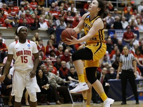 Central Michigan guard Presley Hudson, right, goes up to shoot against Ohio State guard Linnae Harper during the first half of a second-round game in the NCAA women's college basketball tournament in Columbus, Ohio, Monday, March 19, 2018.