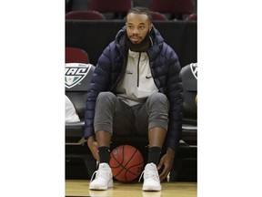 Toledo star guard Tre'Shaun Fletcher watches his team warm up before an NCAA college basketball championship game against Buffalo of the Mid-American Conference tournament, Saturday, March 10, 2018, in Cleveland. Fletcher will miss the Mid-American Conference championship against Buffalo because of an injured left knee.