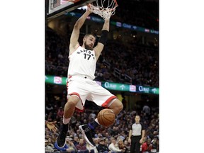 Toronto Raptors' Jonas Valanciunas dunks during the first half of the team's NBA basketball game against the Cleveland Cavaliers, Wednesday, March 21, 2018, in Cleveland.