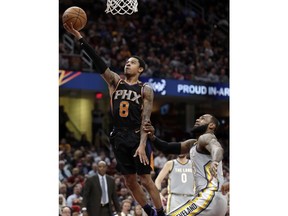 Phoenix Suns' Tyler Ulis (8) drives to the basket against Cleveland Cavaliers' LeBron James (23) during the first half of an NBA basketball game Friday, March 23, 2018, in Cleveland.