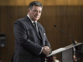 Ontario Finance Minister Charles Sousa takes questions from journalists during a pre-budget lock-up as the Ontario Provincial Government prepares to deliver its 2018 Budget at the Queens Park Legislature in Toronto on Wednesday March 28, 2018.