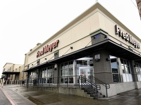 FILE - This March 1, 2018 file photo shows a Fred Meyer store is shown in Portland, Ore., Thursday, March 1, 2018.  The Superstore company says it will stop selling guns and ammunition.  The Portland, Oregon,-based chain in an announcement Friday, March 16 says it made the decision after evaluating customer preferences. The company has more than 130 stores in Oregon, Washington, Idaho and Alaska.