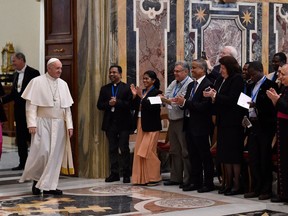 Pope Francis meets members of the International Catholic Migration Commission on the occasion of their Plenary Council, at the Vatican Thursday, March 8, 2018. (L'Osservatore Romano/Pool Photo via AP)