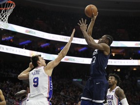 Minnesota Timberwolves' Andrew Wiggins, front right, shoots against Philadelphia 76ers' Dario Saric, left, of Croatia, during the first half of an NBA basketball game, Saturday, March 24, 2018, in Philadelphia.