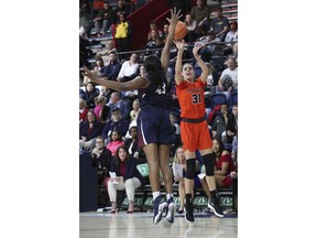 Princeton's Bella Alarie, right, shoots with Pennsylvania's Michelle Nwokedi, left, defending during the first half of an NCAA college basketball championship game in the Ivy League Tournament , Sunday, March 11, 2018, in Philadelphia.