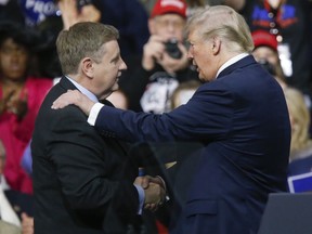 President Donald Trump, right, talks with Republican Rick Saccone during a campaign rally, Saturday, March 10, 2018, in Moon Township, Pa. Saccone is running against Democrat Conor Lamb in a special election being held on March 13 for the Pennsylvania 18th Congressional District vacated by Republican Tim Murphy.