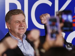 Republican Rick Saccone pumps his fist as he thanks supporters at the party watching the returns for a special election being held for the Pennsylvania 18th Congressional District vacated by Republican Tim Murphy, Tuesday, March 13, 2018 in McKeesport, Pa. A razor's edge separated Democrat Conor Lamb and Saccone Tuesday night in their closely watched special election in Pennsylvania, where a surprisingly strong bid by first-time candidate Lamb was testing Donald Trump's sway in a GOP stronghold.