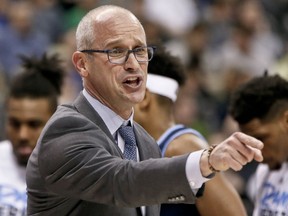 Rhode Island head coach Dan Hurley complains to an official during a timeout during the first half of a second-round game against Duke in the NCAA men's college basketball tournament, Saturday, March 17, 2018, in Pittsburgh.