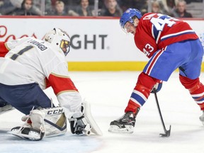 Flordia Panthers' goaltender Roberto Luongo goes down low to stop Montreal Canadiens' Daniel Carr from close in during NHL action Monday night in Montreal. Luongo had 28 saves in the Panthers' 2-0 victory.