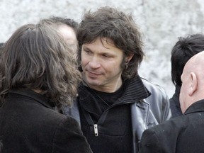 FILE - In this March 20 2009 file photo, French rock singer Bertrand Cantat, center, attends the funeral ceremony of French rock singer Alain Bashung in Paris. Cantat, who was convicted of killing his girlfriend 15 years ago, the actress Marie Trintignant, has pulled out from all the festivals he was scheduled to appear in this summer amid growing protests from feminist groups and politicans.