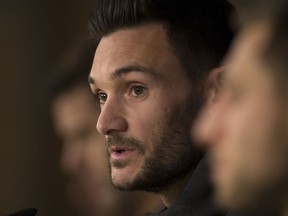 FILE - In this Monday, Oct. 16, 2017 file picture, Tottenham goalkeeper Hugo Lloris answers to a question during a news conference at the Santiago Bernabeu stadium in Madrid, Spain. Tottenham captain Hugo Lloris says in an AP interview that Spurs, which plays Manchester United in the FA Cup semi-finals next month, deserves a trophy because of its "attractive," risk-taking football.