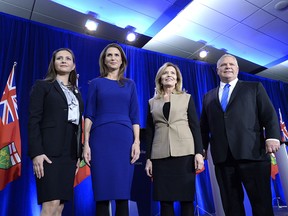 Ontario PC leadership candidates Tanya Granic Allen, Caroline Mulroney, Christine Elliott and Doug Ford pose for a photo after a debate in Ottawa on Feb. 28, 2018.