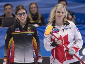 Canada skip Jennifer Jones shares a laugh with Germany skip Daniela Jentsch during World Women's Curling Championship action in North Bay, Ont., Sunday, March 18, 2018.