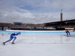 Sverre Lunde Pedersen of Norway, left, competes against Patrick Roest of The Netherlands, right, during the men's 1,500 meters race the World Championships Speedskating Allround at the Olympic stadium in Amsterdam, Netherlands, Sunday, March 11, 2018.