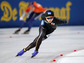 Miho Takagi of Japan competes against Ireen Wust of The Netherlands, rear, during the women's 1,500 meters race at the World Championships Speedskating Allround at the Olympic stadium in Amsterdam, Netherlands, Saturday, March 10, 2018.