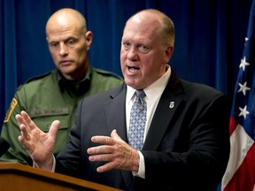 FILE - In this Dec. 5, 2017, file photo, acting Director for U.S. Immigration and Customs Enforcement Thomas Homan, right, speaks as U.S. Customs and Border Protection Acting Deputy Commissioner Ronald Vitiello, looks on at a Department of Homeland Security news conference in Washington. At a round table on sanctuary cities at the White House on Tuesday, March 20, 2018, Homan mentioned three Northern California cases as examples of "undocumented criminals" who have reoffended after being released by California authorities.