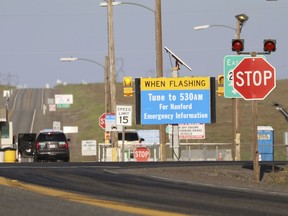 FILE - In this May 9, 2017, file photo, an emergency sign flashes outside the Hanford Nuclear Reservation in Benton County Tuesday in Washington state. The federal government is demanding that the company building a giant nuclear waste treatment plant in Washington state provide records proving that the steel used in the nearly $17 billion project meets safety standards.