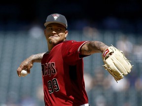 Arizona Diamondbacks pitcher Taijuan Walker throws a pitch against the Cleveland Indians during the second inning of a spring training baseball game Tuesday, March 27, 2018, in Phoenix.