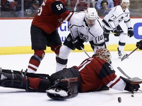 Arizona Coyotes goaltender Adin Hill, right, makes a save on a shot by Los Angeles Kings center Tobias Rieder (10) during the first period of an NHL hockey game Tuesday, March 13, 2018, in Glendale, Ariz.