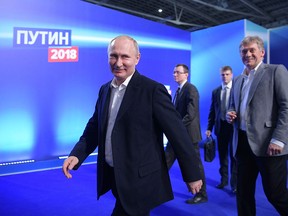 Russian President Vladimir Putin visits his campaign headquarters in Moscow on March 18, 2018.