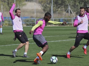 In this photo taken on Thursday Feb. 22, 2018, Shaq Moore, center, trains with Spanish soccer club Levante in Valencia, Spain. Young American soccer player Shaq Moore is trying to make it in Europe the hard way, going to the old continent as a teenager to join smaller teams and try to move up in his career like other European youngsters. Currently with the first team of Levante, he now he is having a chance to play against Lionel Messi and Cristiano Ronaldo in La Liga.