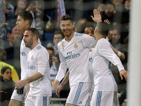Real Madrid's Cristiano Ronaldo, center, celebrates after scoring during a Spanish La Liga soccer match between Real Madrid and Girona at the Santiago Bernabeu stadium in Madrid, Spain, Sunday, March 18, 2018.