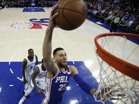 Philadelphia 76ers' Ben Simmons (25) goes up for a dunk during the first half of the team's NBA basketball game against the Memphis Grizzlies, Wednesday, March 21, 2018, in Philadelphia.