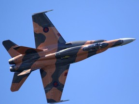 Capt. Denis Beaulieu flies the CF-18 upside down at the Wings Over Springbank air show at Springbank Airport west of Calgary, Ab., on Saturday July 18, 2015.