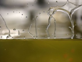 In this Tuesday, March 6, 2018 photo, corn syrup forms patterns on the side of a tank of 2,000 pounds of the syrup in a lab at the University of Rhode Island Graduate School of Oceanography, in Narragansett, R.I. During experiments, the syrup represents the Earth's mantle,\ which melts to form magma at volcanoes and ridges. One minute of each experiment equals more than 1 million years in time, to show how tectonic plates move mantel material on the ocean floor.