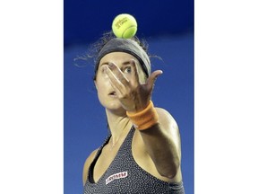 Switzerland's Stefanie Voegele serves against Ukraine's Lesia Tsurenko during the women's final at the Mexican Tennis Open in Acapulco, Mexico, Saturday, March 3, 2018.