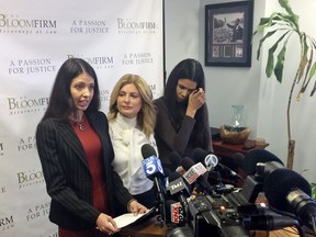 Former model Faviola Dadis, left, reads from a statement at a news conference with her attorney, Lisa Bloom, center, in Los Angeles Monday, March 19, 2018. Dadis, an aspiring actress says she was 17 when actor Steven Seagal sexually assaulted her during a supposed casting session in 2002. At right, Regina Simons who has also accused Seagal of sexual misconduct. Seagal's attorney has not responded to a request for comment about Dadis' allegations.