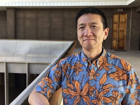 FILE - In this March 1, 2018 file photo, Hawaii Lt. Gov. Doug Chin poses for a photo in Honolulu. Chin, a well-known Democratic candidate for Congress who gained notoriety opposing President Donald Trump's travel ban targeting mostly-Muslim countries is being forced to explain a decades-old rant perceived as intolerant of gay people. Chin said he won't "quibble" about what's on a recording posted on YouTube last year, or its context, and has apologized.