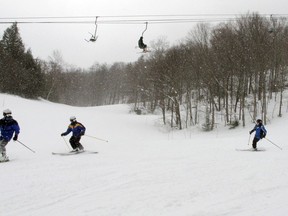 In this March 15, 2018, photo, skiers head down a slope at Mad River Glen in Fayston, Vt. Three successive March snowstorms have provided good conditions for late-season skiing.