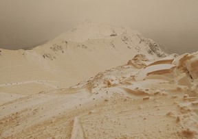 This handout photo taken on Friday, March 23, 2018, shows orange snow in the mountains at the Rosa Khutor ski resort near Rosa Khutor, outside Sochi, Russia.