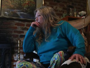 Jo Osborn pauses while discussing her next door neighbor Rosalie Santallan Achiu, Friday, March 16, 2018, in North Highlands, Calif. Two Sacramento County sheriff's deputies are being investigated on allegations of stealing money from Achiu, 75, and putting her on a plane to the Philippines.