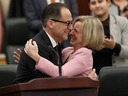 Alberta Finance Minister Joe Ceci hugs Premier Rachel Notley after delivering the 2018-19 budget in the Alberta Legislature on March 22.