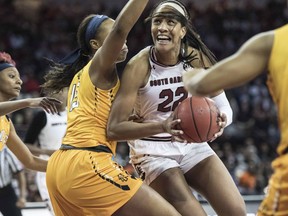 South Carolina forward A'ja Wilson, right, drives to the hoop against North Carolina A&T center Alexis Lessears, left, during the first half of game in the first-round of the NCAA women's college basketball tournament, Friday, March 16, 2018, in Columbia, S.C.