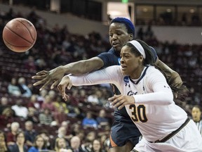 California center CJ West, right, battles for a rebound against Virginia center Felicia Aiyeotan, left, during the second half of game in the first-round of the NCAA women's college basketball tournament, Friday, March 16, 2018, in Columbia, S.C. Virginia defeated California 68-62.