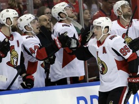 Matt Duchene, right, of the Ottawa Senators gets congrats from teammate Jean-Gabriel Pageau on the bench after scoring his second goal of the night in a 5-3 win over the Florida Panthers in Sunrise, Fla. on Monday.
