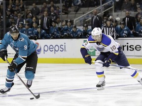 San Jose Sharks' Evander Kane, left, is chased by St. Louis Blues' Brayden Schenn (10) during the first period of an NHL hockey game Thursday, March 8, 2018, in San Jose, Calif.