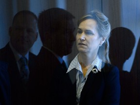 Greta Bossenmaier, Chief of Communications Security Establishment, is photographed through a door as she arrives to appear at a Commons public safety committee in Ottawa on Thursday, March 22, 2018.