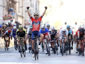 Vincenzo Nibali celebrates as he crosses the finish line to win the Milan-San Remo cycling race, in Sanremo, March 17, 2018. Nibali carried off a daring solo attack to perfection to win the Milan-San Remo classic Saturday and add to his long list of major achievements in cycling.